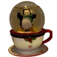 penguin in snow globe on cup