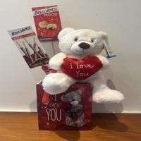 cute teddy bear in box of chocolate